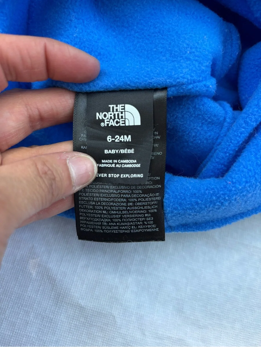 The North Face Fleece Earflap Pom-Pom Hats in Cream & Light Blue
